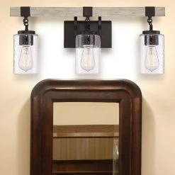 24.5 in. 3-Light Bronze Vanity Light with Clear Seedy Glass Shades by Cordelia Lighting 23 24.5 in. 3-Light Bronze Vanity Light with Clear Seedy Glass Shades by Cordelia Lighting -Spitzer Sales Store bronze cordelia lighting vanity lighting 2633 330 44 1000